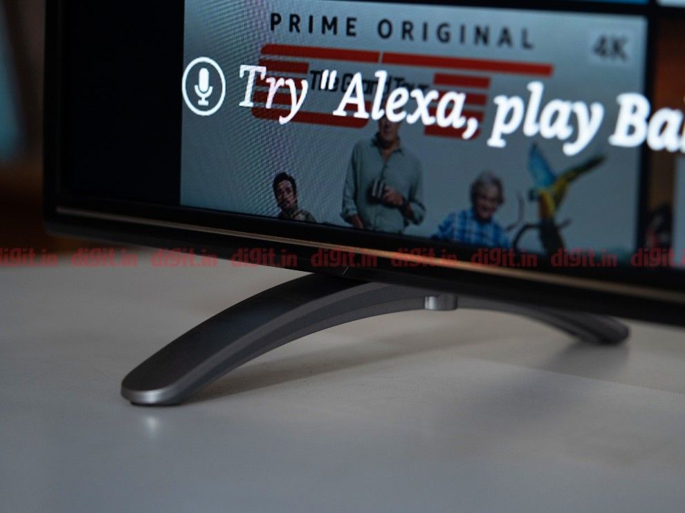 The AmazonBasics 55-inch TV stands on 2 metal feet. 