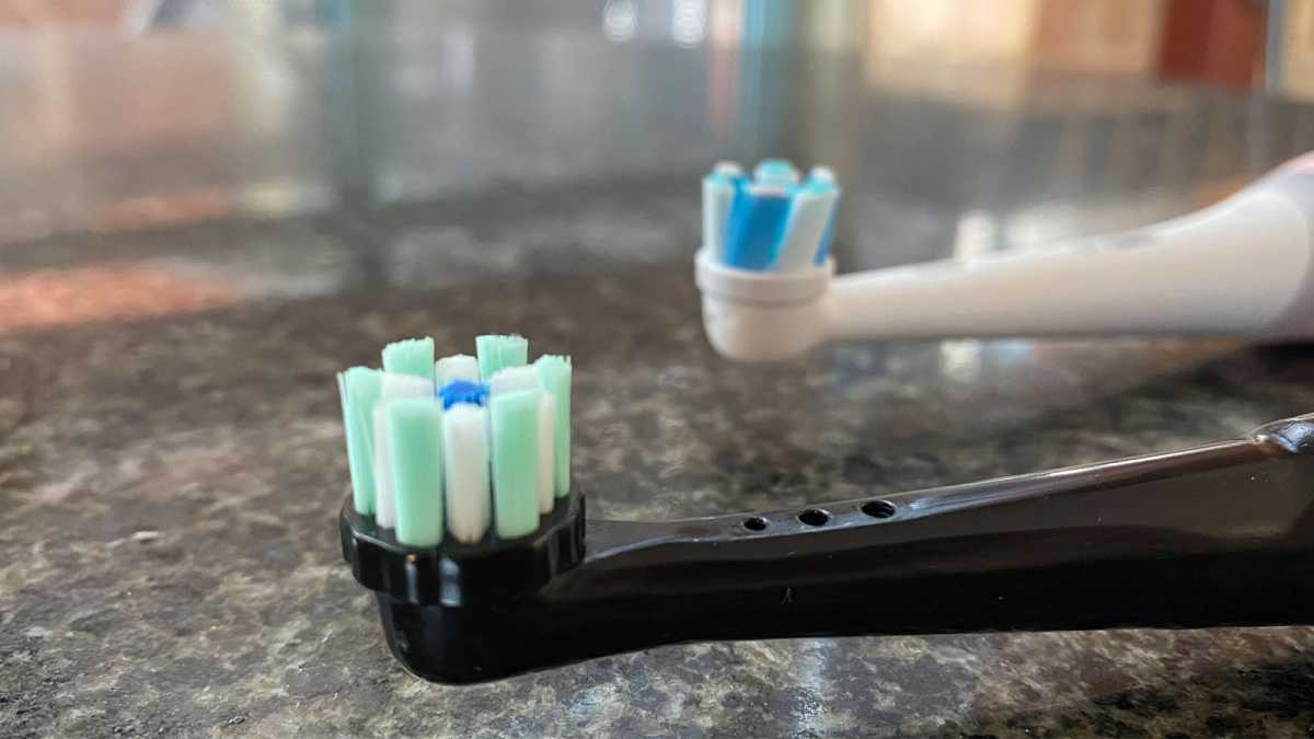 Close-up views of two electric toothbrush heads