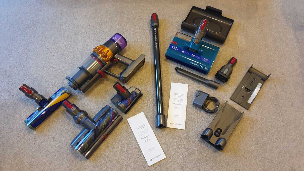 A view of the Dyson V15S Detect Submarine parts and accessories on a beige carpet